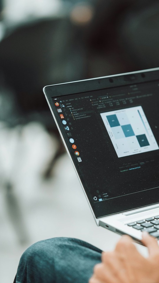 A laptop screen showing analytics charts